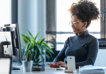 Sri Lankan expat working in office with work permit and who sends money home via ACE Money Transfer