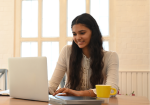 A girl from bangladesh using laptop to send money to Bangladesh via ACE Money Transfer